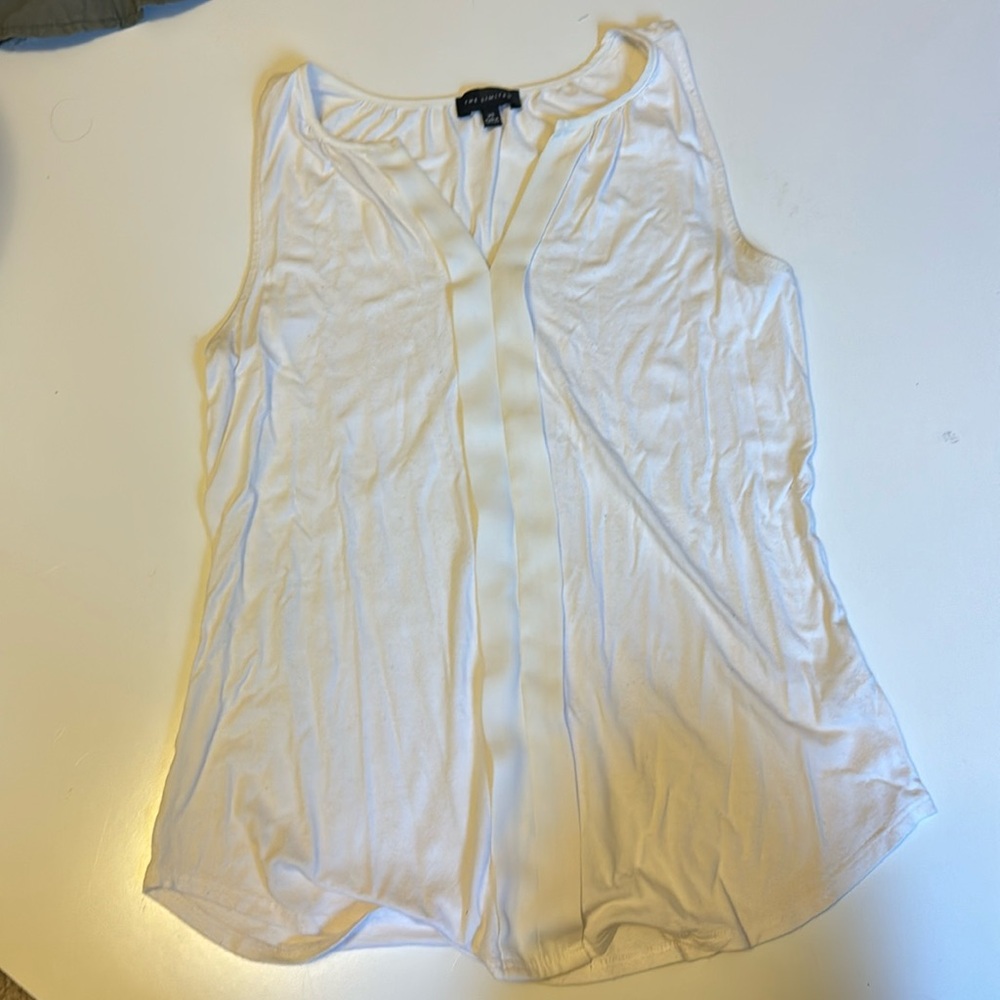 The limited XS sleeveless white tank
